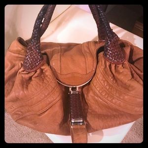 Handbag. Minor wear on bottom&side.  Small pen mark which is not noticeable.